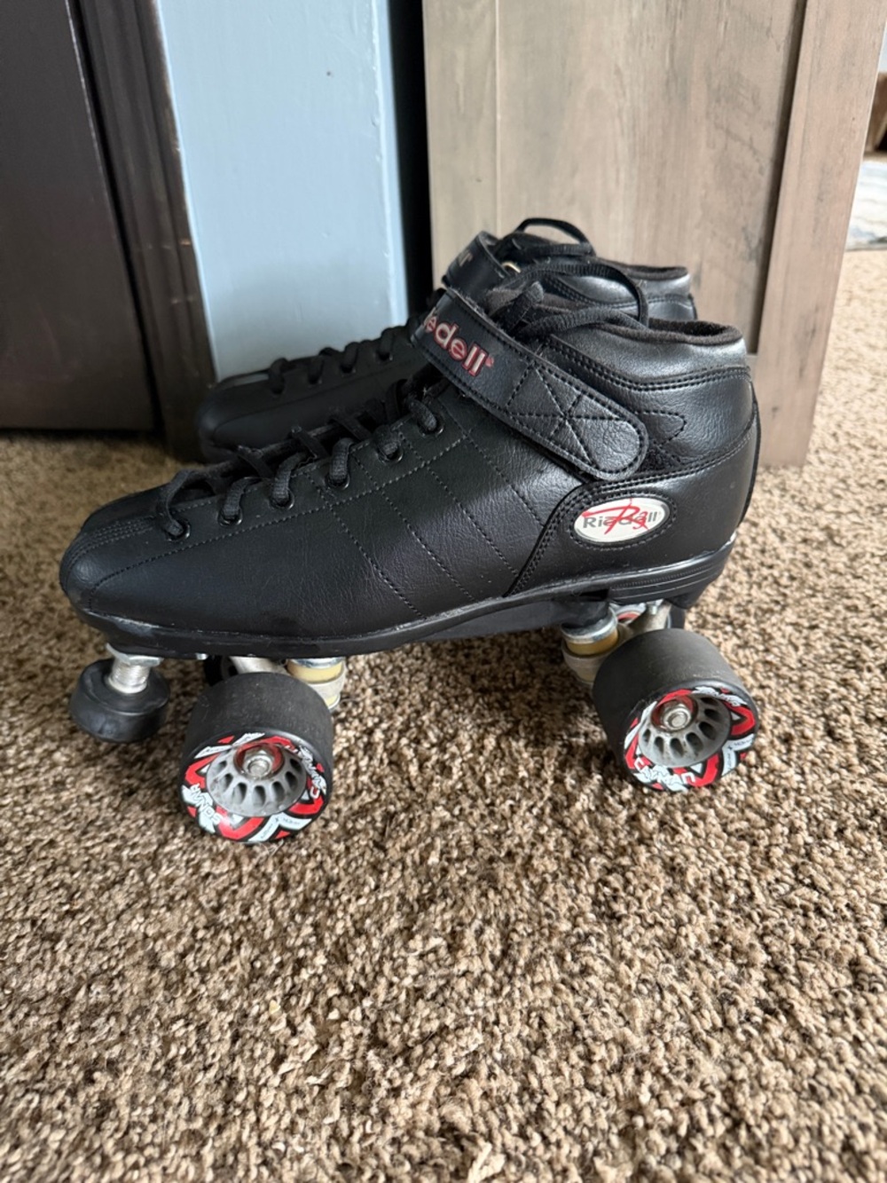 Riedel Black Quad Roller Skates with Red-Accented Wheels